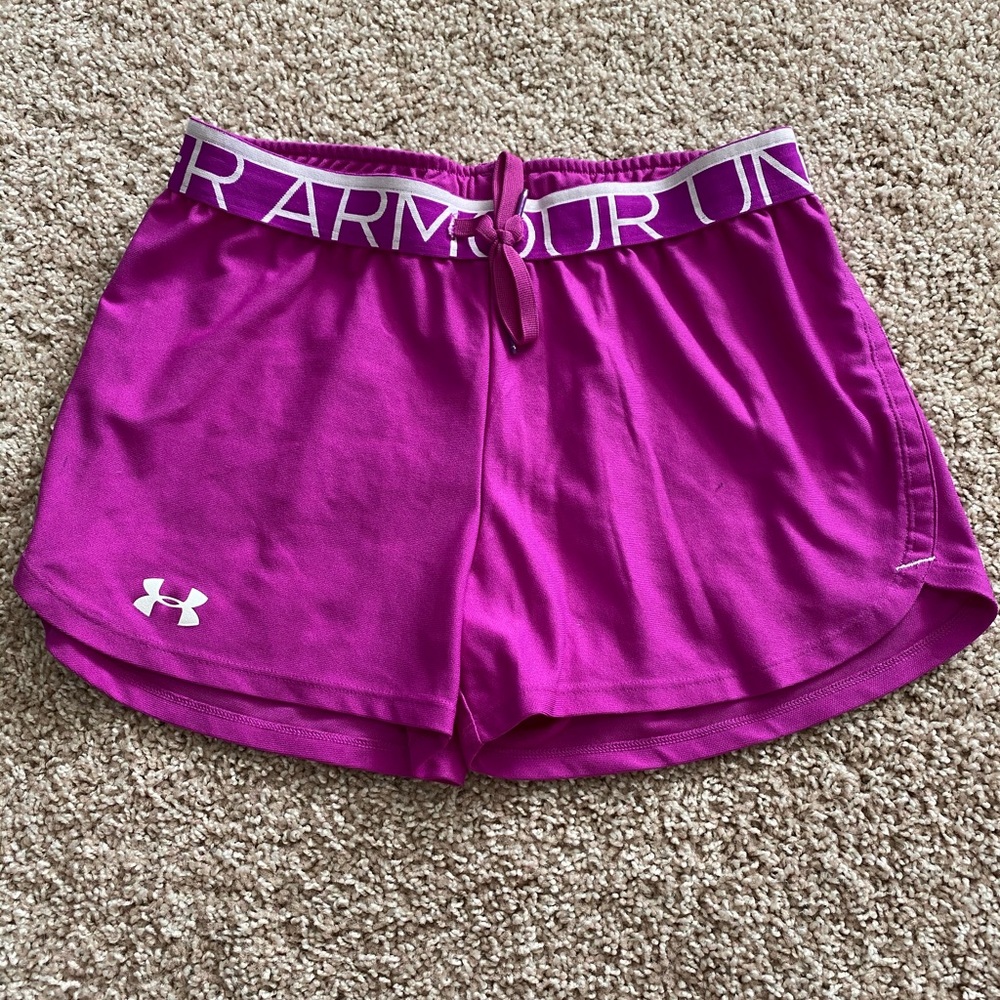 Under Armour magenta athletic shorts.